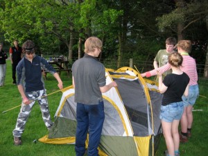 Pulling together to erect the tent