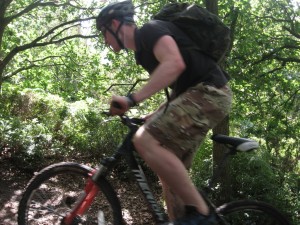 Bike_Blur Working hard uphill through the trees