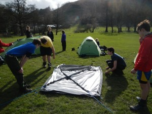 Getting the tents up in the sun